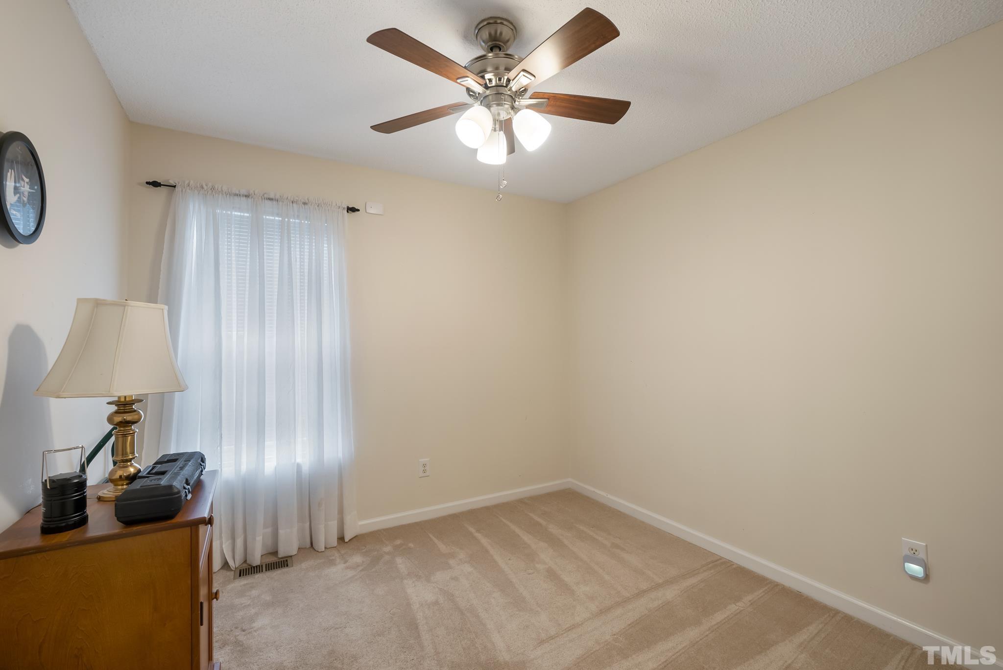 3500 Milky Way Raleigh, NC 27604 - Photo 17 of 30 a view of an empty room and cabinet with a fan