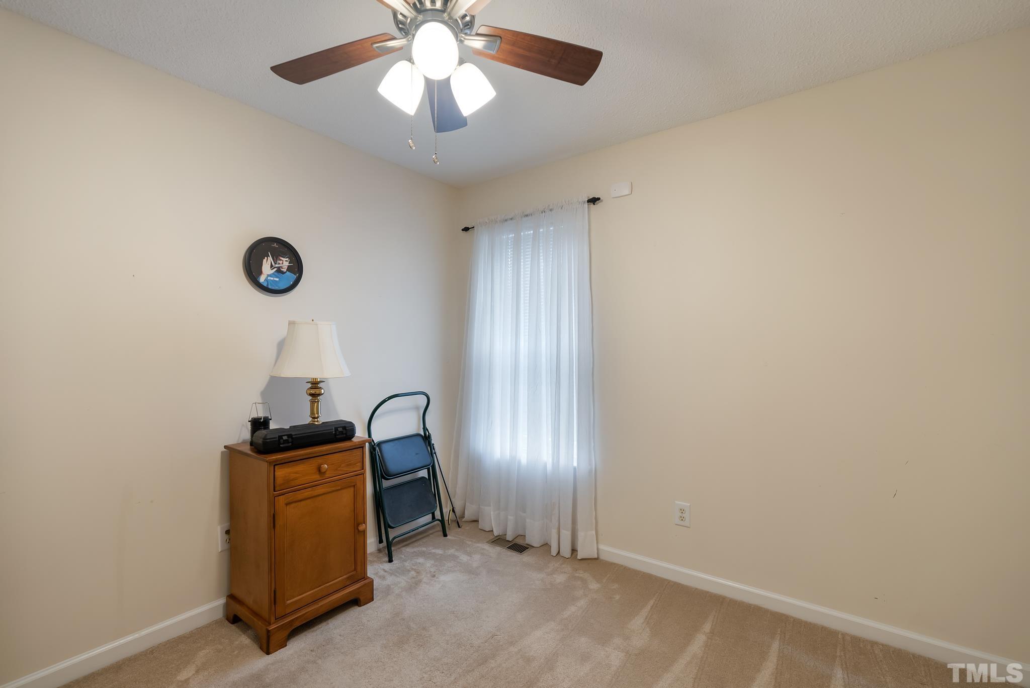 3500 Milky Way Raleigh, NC 27604 - Photo 18 of 30 an empty room with windows and fan