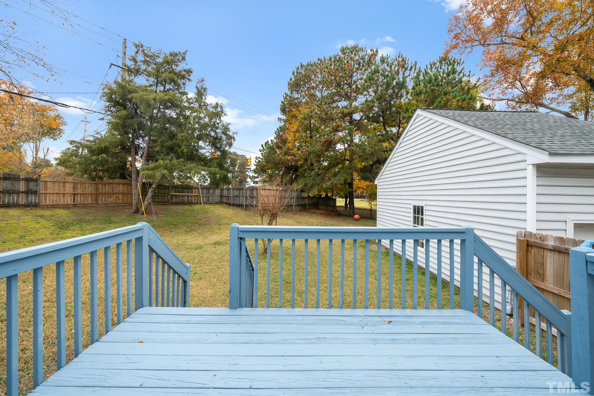 3500 Milky Way Raleigh, NC 27604 - Photo 24 of 30 a view of deck with lake and trees in the background