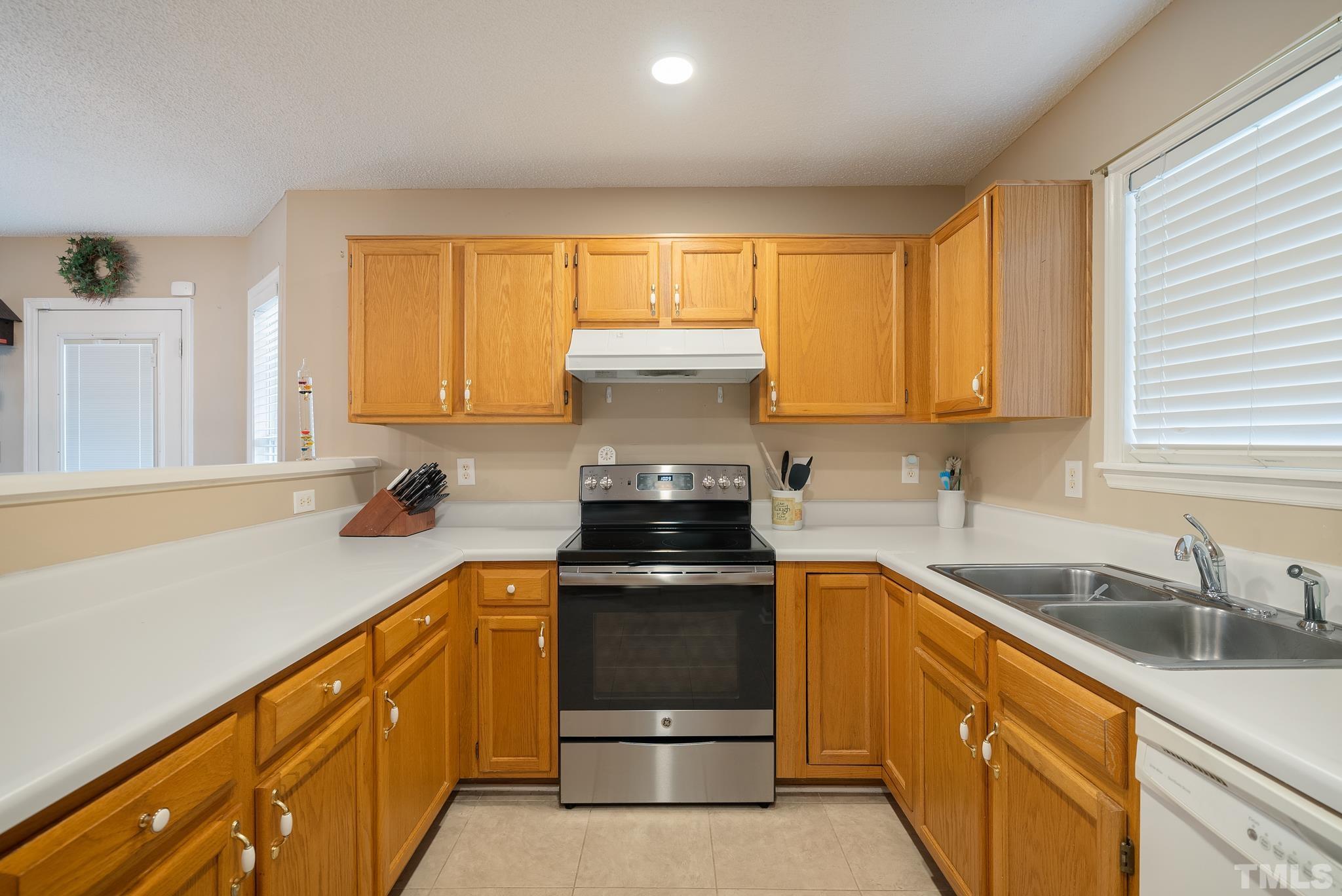 3500 Milky Way Raleigh, NC 27604 - Photo 8 of 30 a kitchen with stainless steel appliances granite countertop a sink stove and cabinets