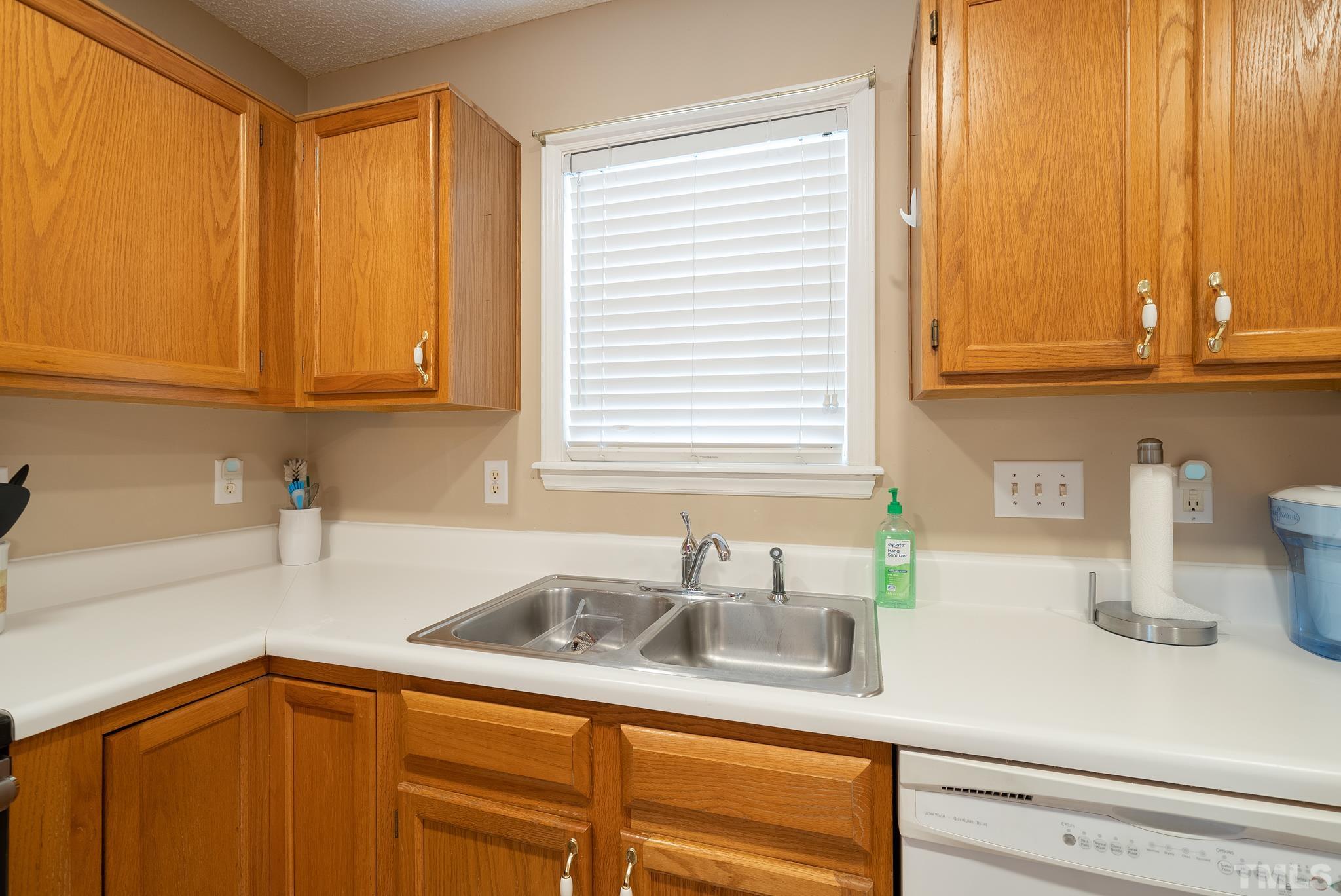 3500 Milky Way Raleigh, NC 27604 - Photo 10 of 30 a kitchen with stainless steel appliances granite countertop a sink and a window