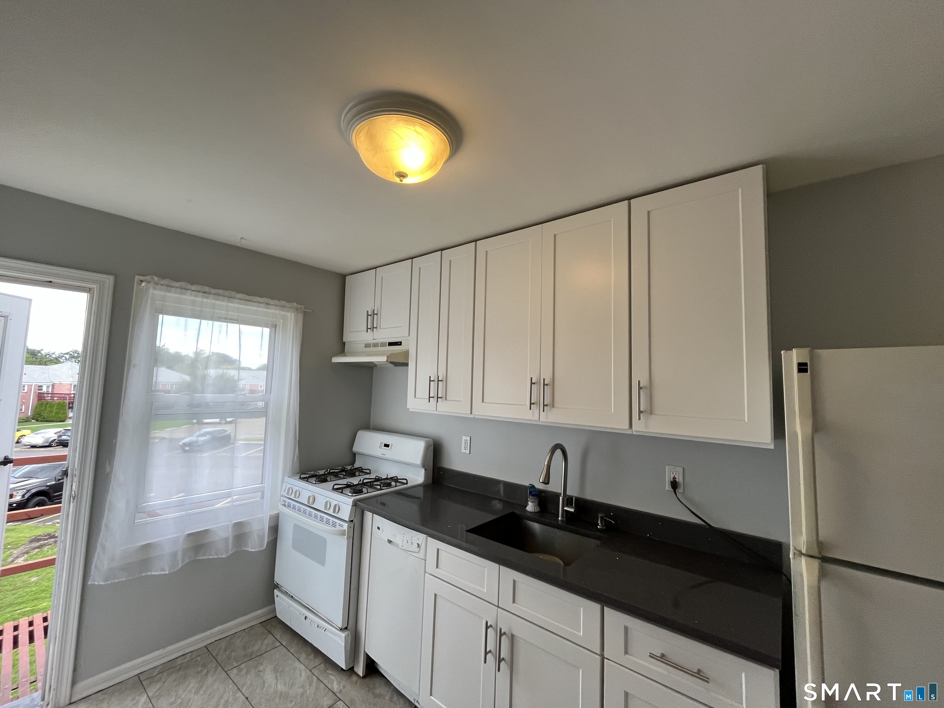 34 Standish Road, Unit 4 Stamford, CT 06902 - Photo 4 of 17 Updated kitchen with access to back of complex