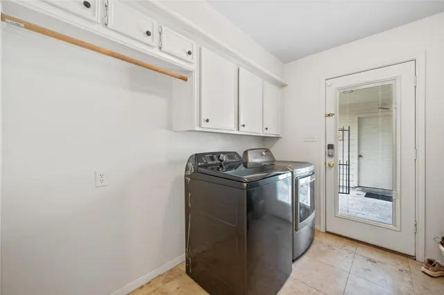 a utility room with washer and dryer