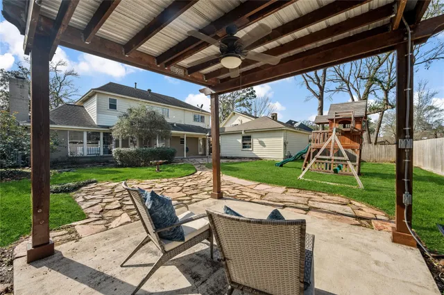 a view of yard with patio
