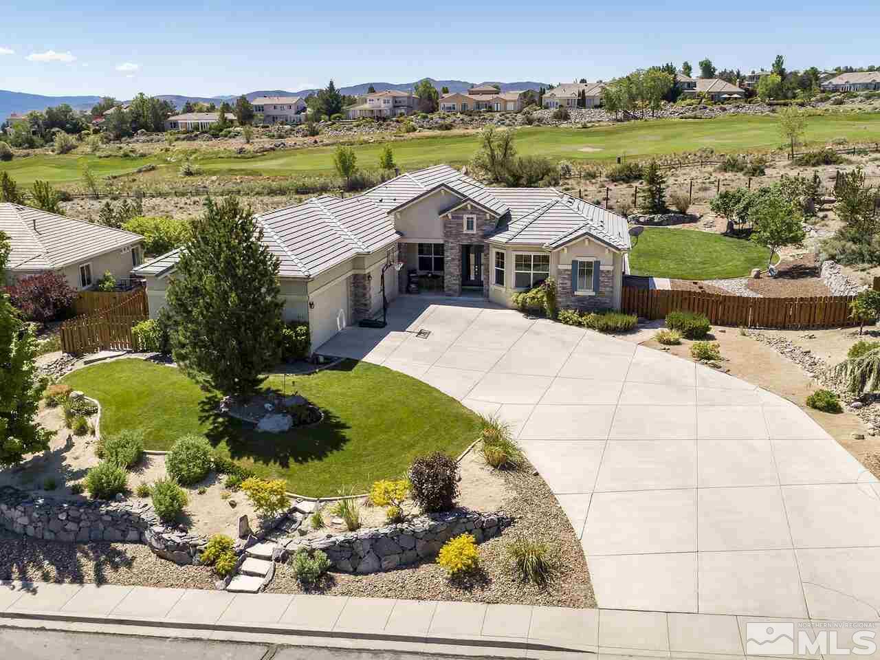 895 Peacepipe Loop Reno, NV 89511 - Photo 1 of 37 an aerial view of a house with a ocean view