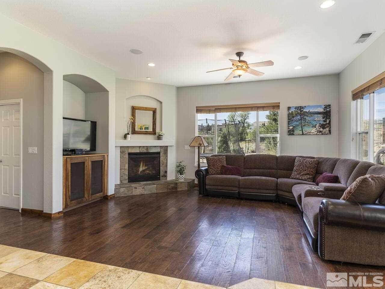 895 Peacepipe Loop Reno, NV 89511 - Photo 11 of 37 a living room with furniture and a fireplace