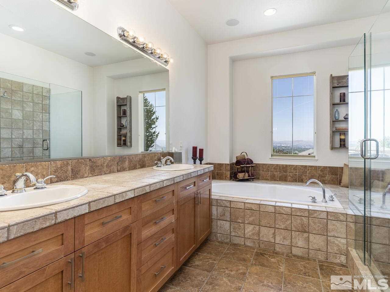 895 Peacepipe Loop Reno, NV 89511 - Photo 17 of 37 a bathroom with a sink double vanity granite and a mirror