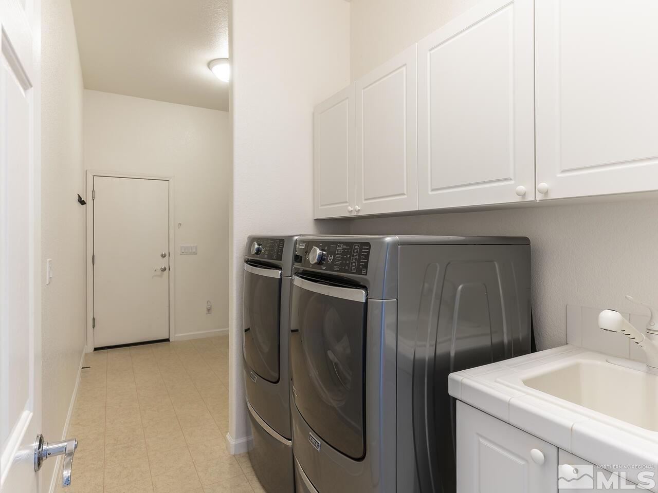 895 Peacepipe Loop Reno, NV 89511 - Photo 24 of 37 a utility room with dryer and washer