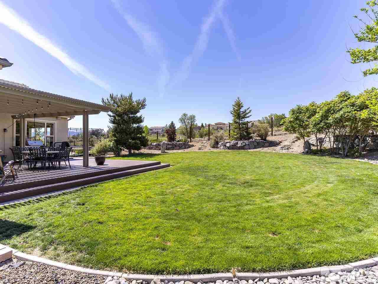 895 Peacepipe Loop Reno, NV 89511 - Photo 25 of 37 a view of swimming pool and outdoor seating