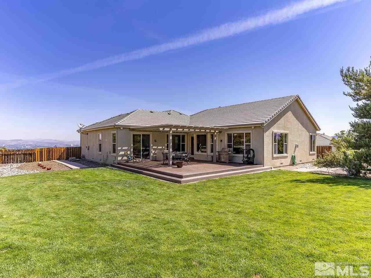 895 Peacepipe Loop Reno, NV 89511 - Photo 26 of 37 a front view of house with yard and seating area