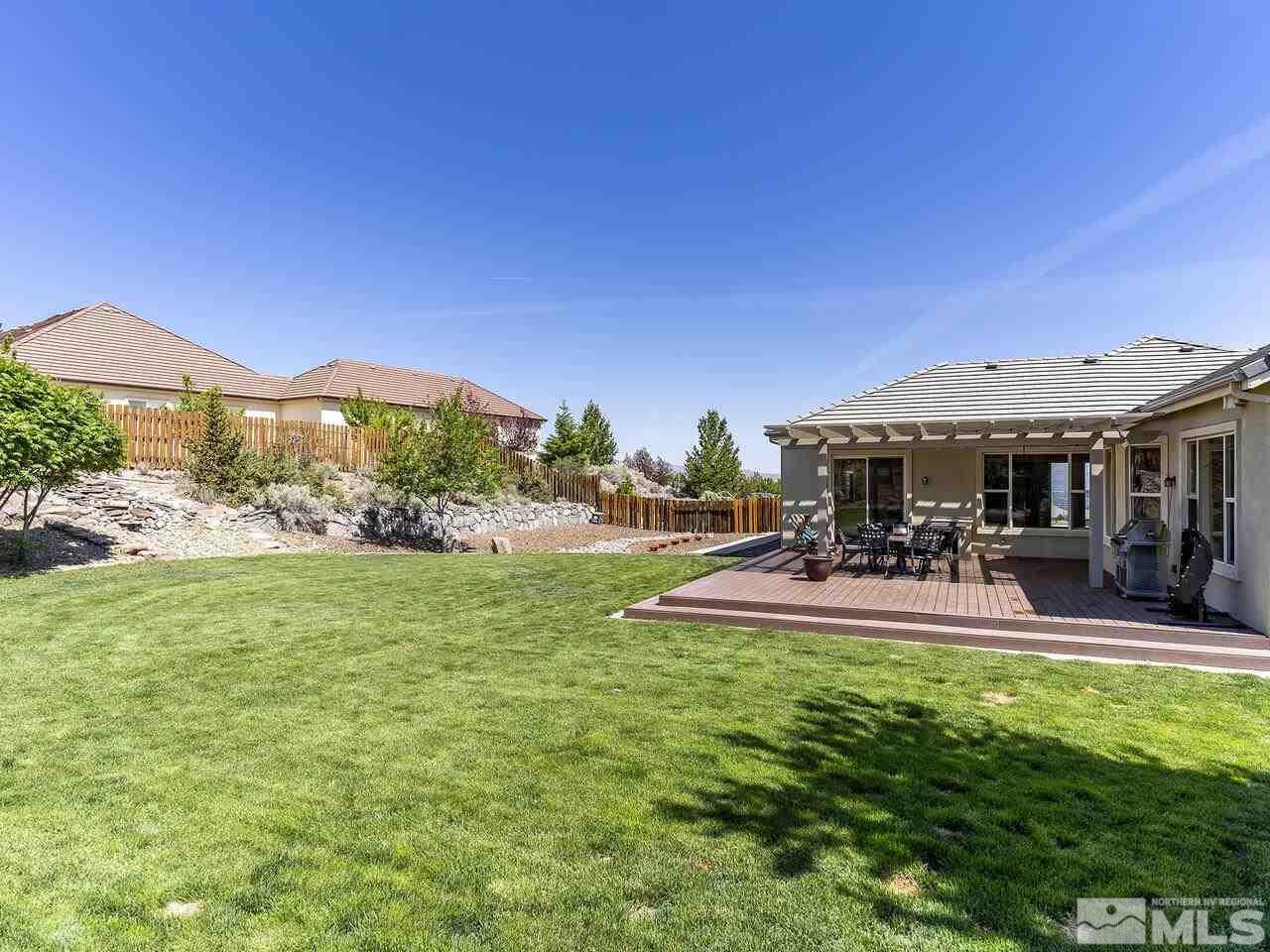 895 Peacepipe Loop Reno, NV 89511 - Photo 27 of 37 a view of a house with backyard porch and sitting area