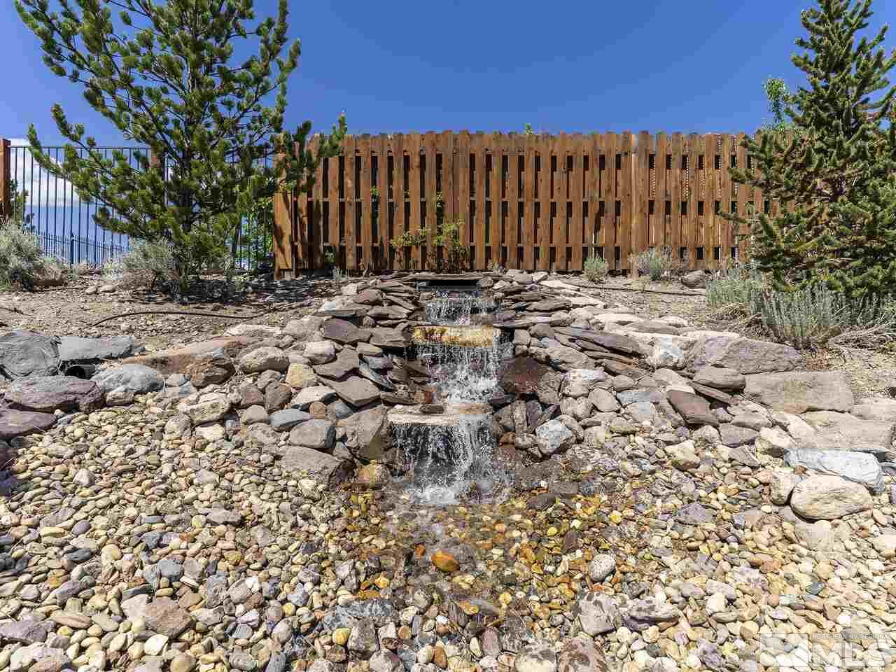 895 Peacepipe Loop Reno, NV 89511 - Photo 29 of 37 a view of a pathway with a building in the background