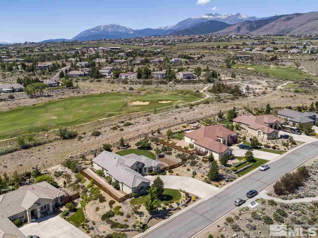 895 Peacepipe Loop Reno, NV 89511 - Photo 3 of 37 an aerial view of residential houses with outdoor space