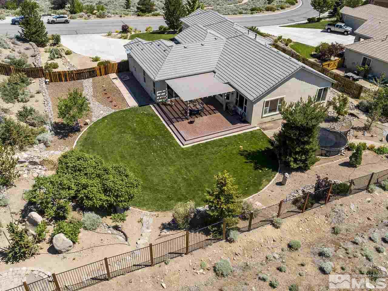 895 Peacepipe Loop Reno, NV 89511 - Photo 31 of 37 an aerial view of a house with a yard and lake view