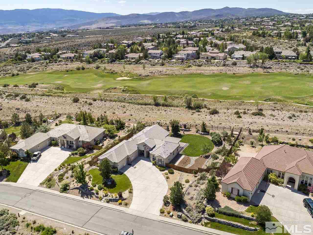 895 Peacepipe Loop Reno, NV 89511 - Photo 32 of 37 an aerial view of residential houses with outdoor space