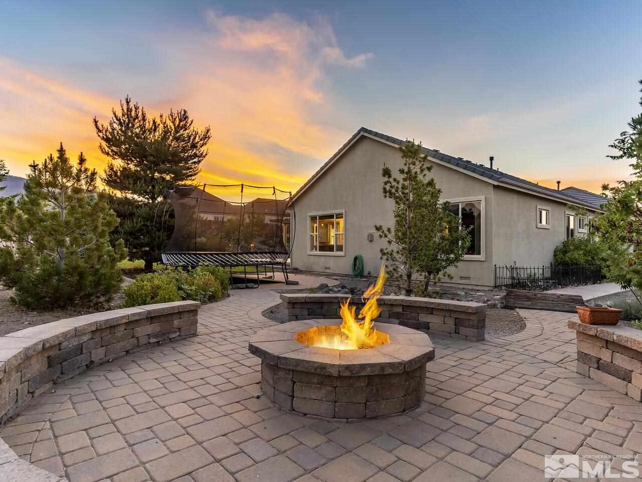 895 Peacepipe Loop Reno, NV 89511 - Photo 35 of 37 a view of a backyard with swimming pool and furniture