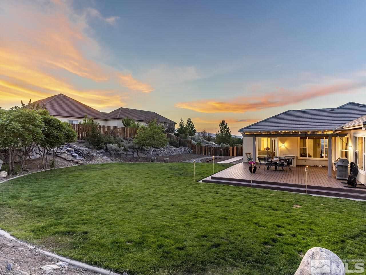 895 Peacepipe Loop Reno, NV 89511 - Photo 36 of 37 a view of a house with a backyard porch and sitting area
