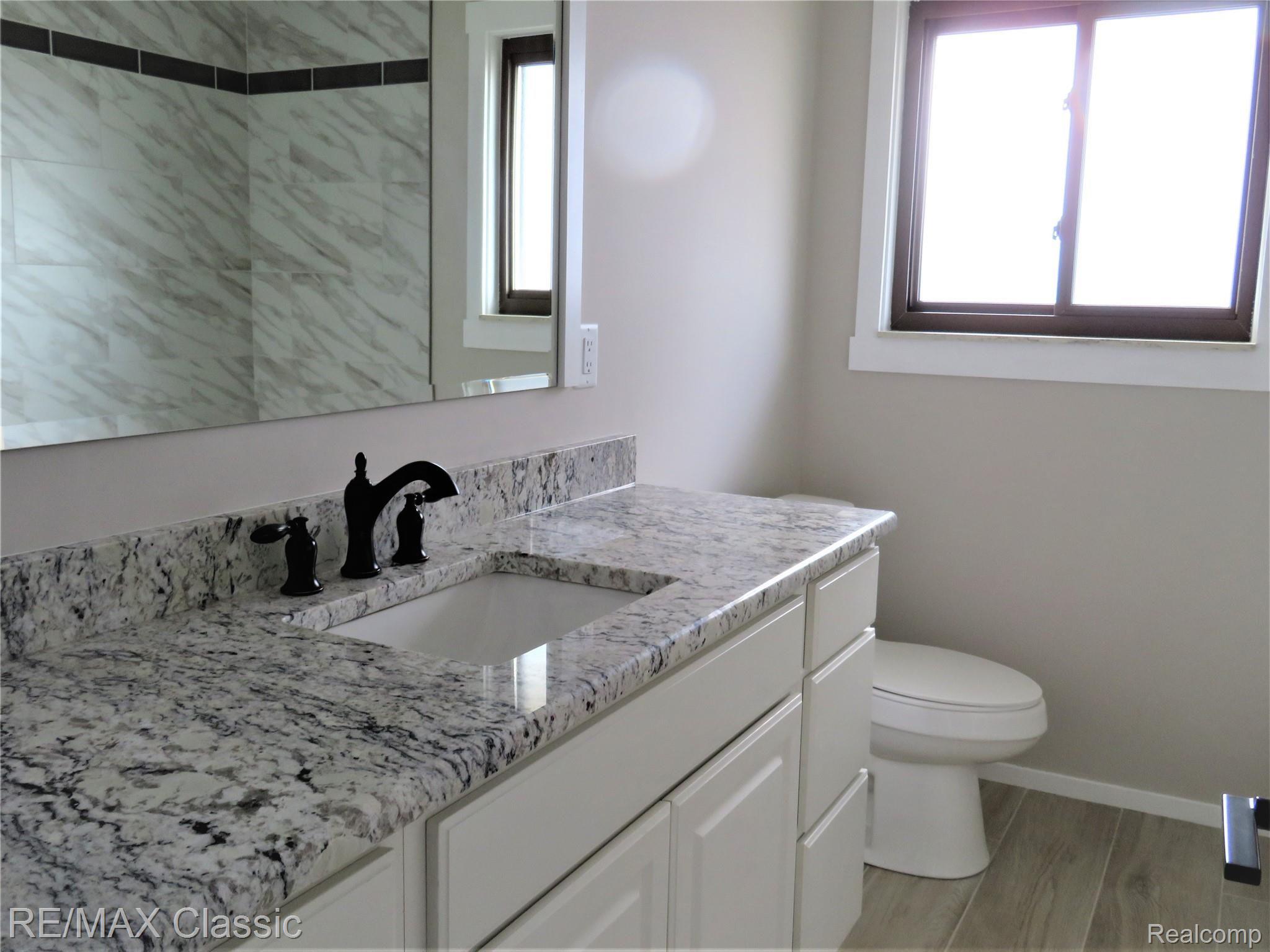 43032 Avon Road Canton, MI 48187 - Photo 20 of 37 Elongated, dual flush toilets.