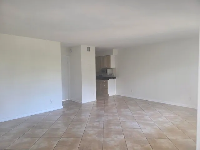 a view of a kitchen with a sink