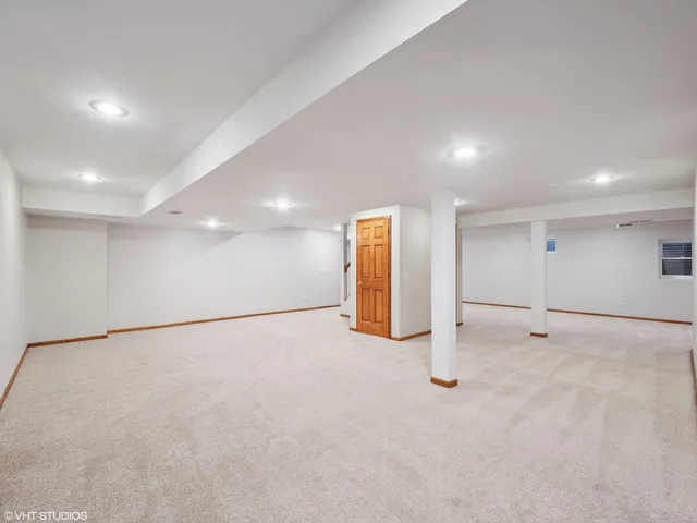 a view of an empty room with closet
