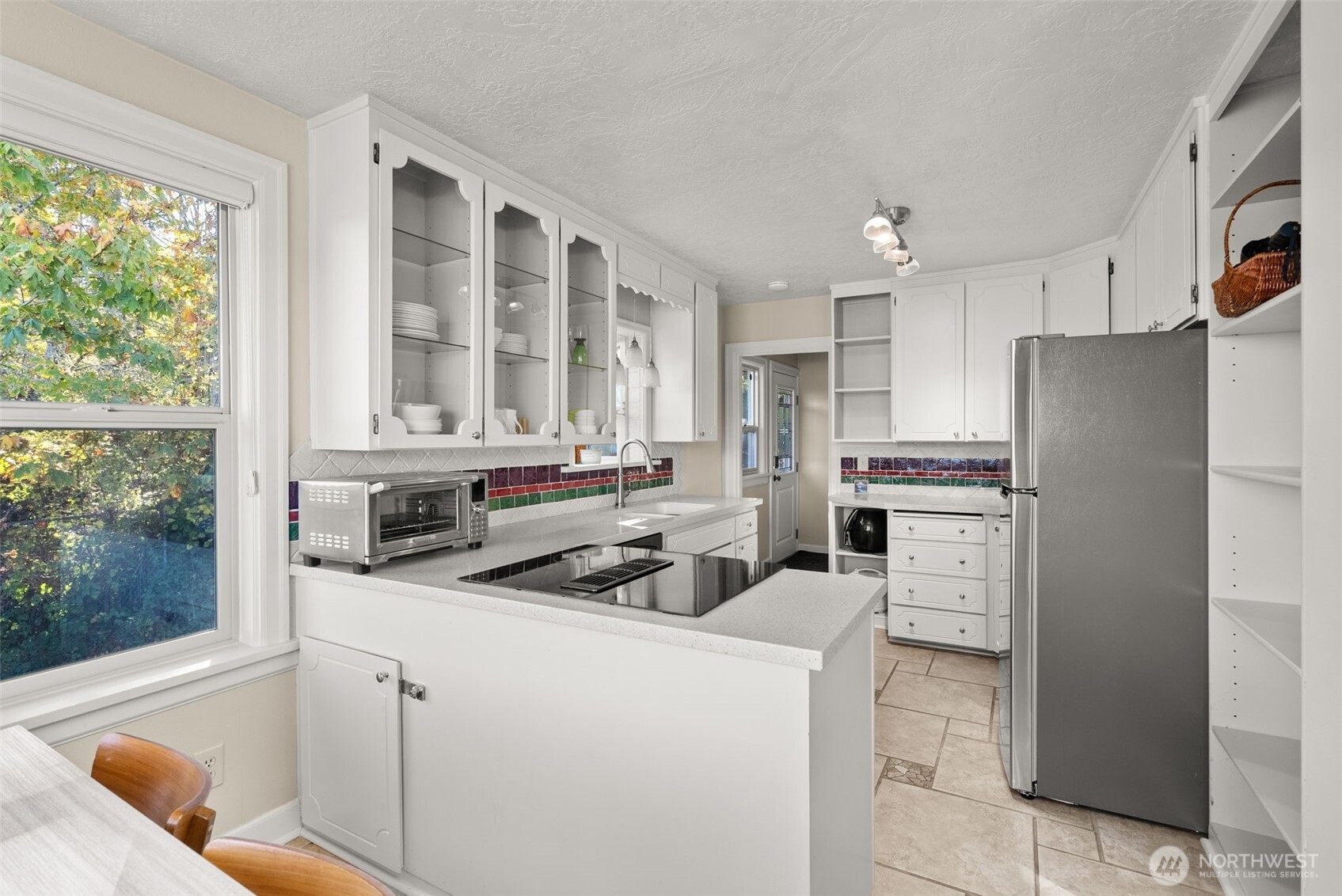 5208 Illahee Road Northeast Bremerton, WA 98311 - Photo 11 of 39 a kitchen that has a refrigerator and a stove