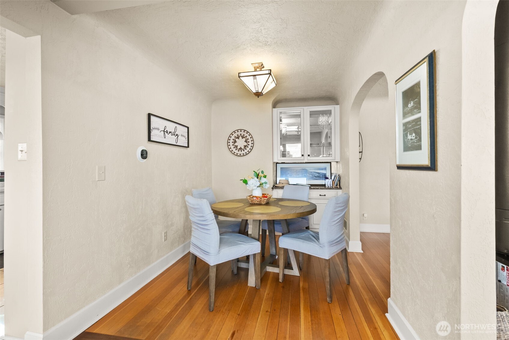 5208 Illahee Road Northeast Bremerton, WA 98311 - Photo 15 of 39 a view of a dining room with furniture and wooden floor