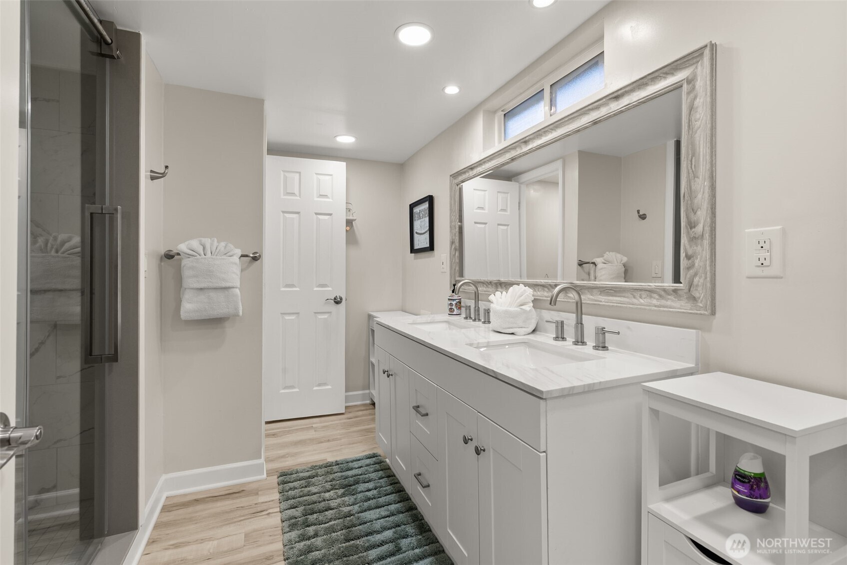 5208 Illahee Road Northeast Bremerton, WA 98311 - Photo 30 of 39 a spacious bathroom with a sink and a mirror