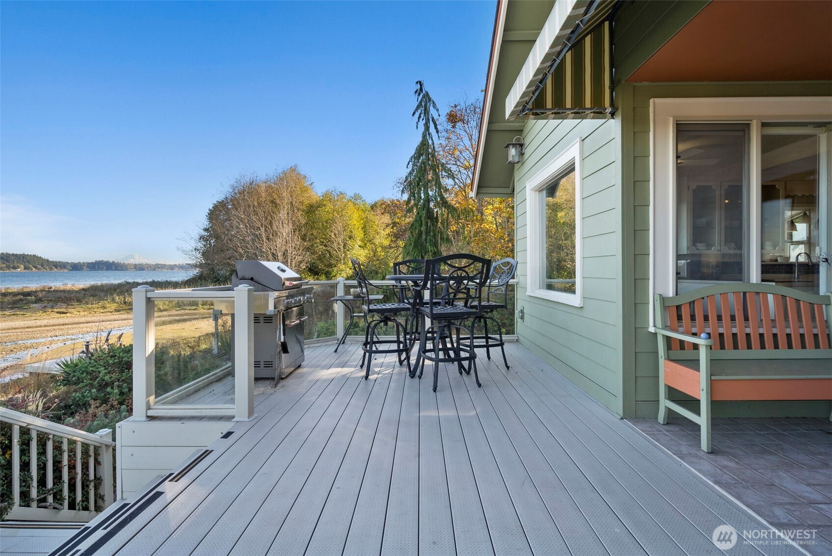 5208 Illahee Road Northeast Bremerton, WA 98311 - Photo 7 of 39 a view of a chairs and table on the wooden deck