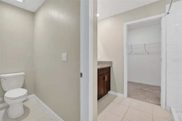 a bathroom with a granite countertop sink a shower and a mirror