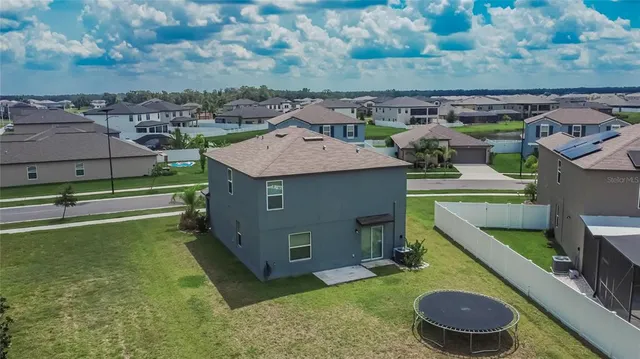 an aerial view of a house with a garden