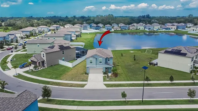an aerial view of a house with a garden