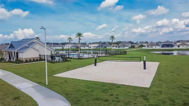 an aerial view of house with yard swimming pool and outdoor seating