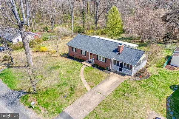 an aerial view of a house with swimming pool
