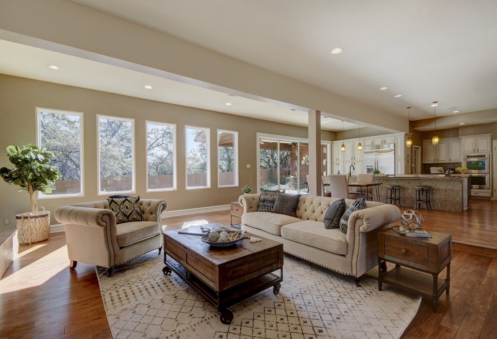 a living room with furniture and a large window