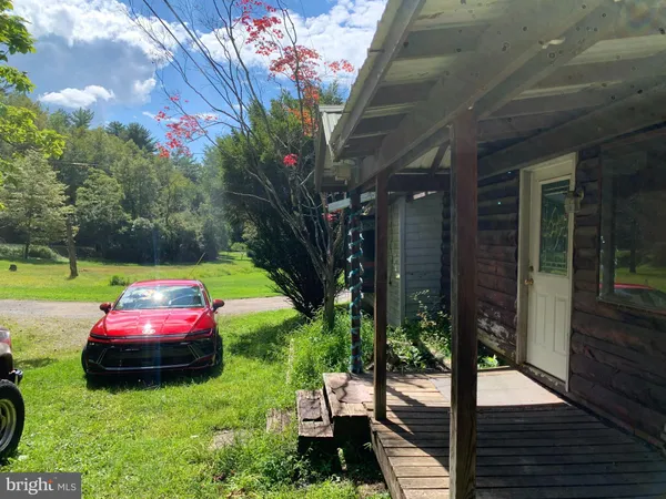 a view of yard with patio