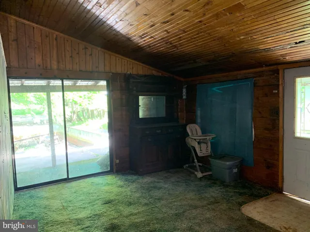 a room with furniture and a window