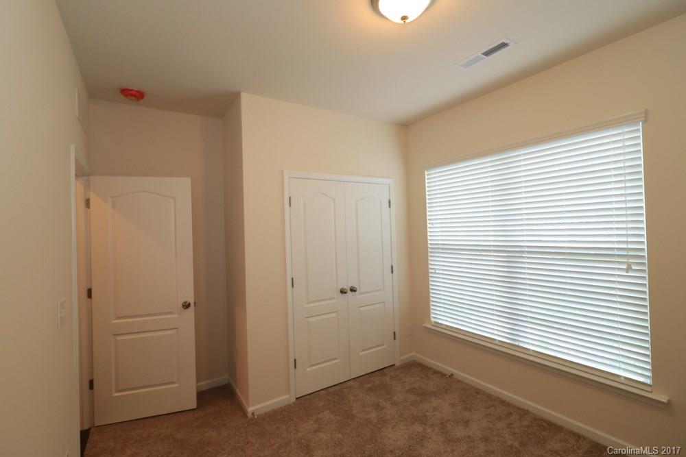 156 Hawks Creek Parkway, Unit 16 Fort Mill, SC 29708 - Photo 11 of 21 a view of an empty room with a window