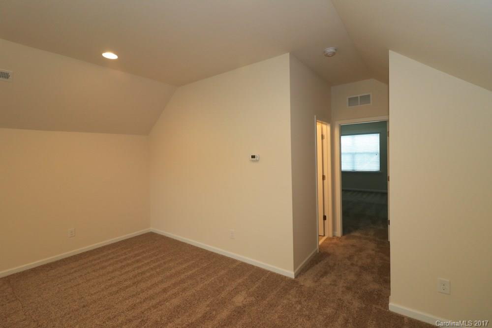 156 Hawks Creek Parkway, Unit 16 Fort Mill, SC 29708 - Photo 16 of 21 wooden floor in an empty room with a window