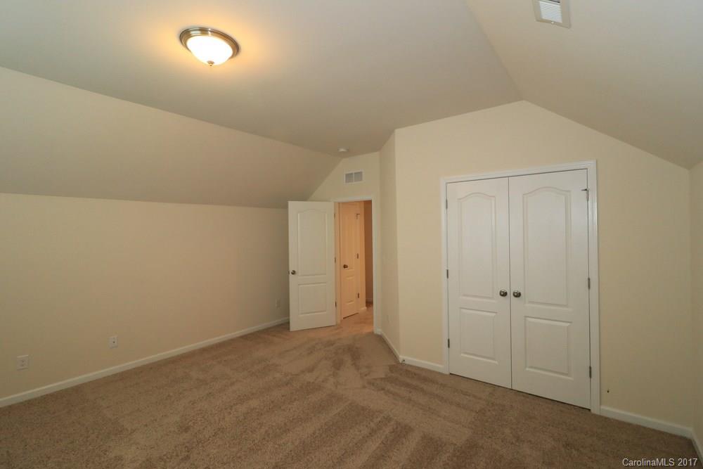 156 Hawks Creek Parkway, Unit 16 Fort Mill, SC 29708 - Photo 19 of 21 an empty room with closet area