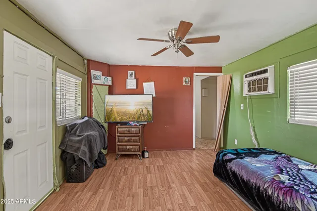 a bedroom with a bed and a window