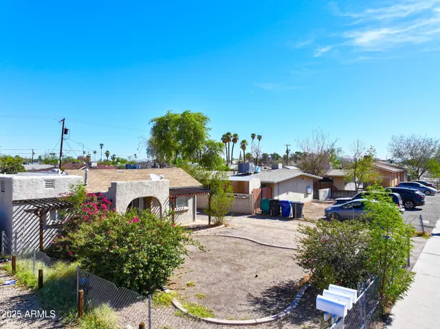 a swimming pool with outdoor seating and yard