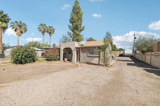 a spacious bathroom with a sink and a mirror