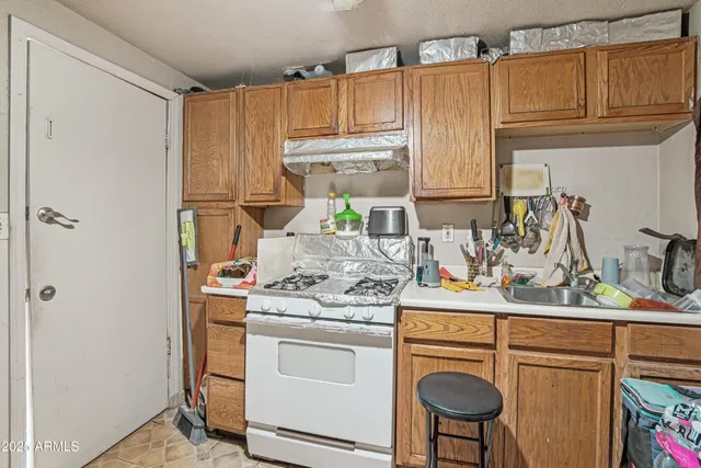 a kitchen with appliances cabinets and a window