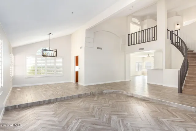 a view of an entryway with wooden floor