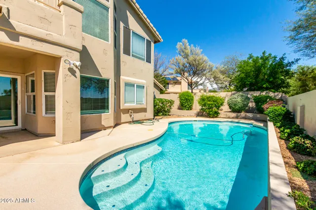 a living room with furniture flat screen tv and a fireplace