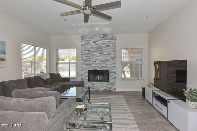 a living room with furniture and a large window