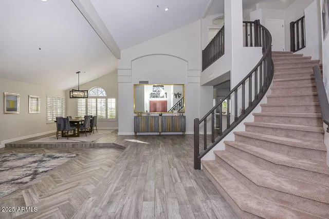 a kitchen with granite countertop a sink stove top oven and cabinets