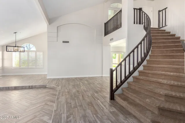 a view of an entryway with wooden floor