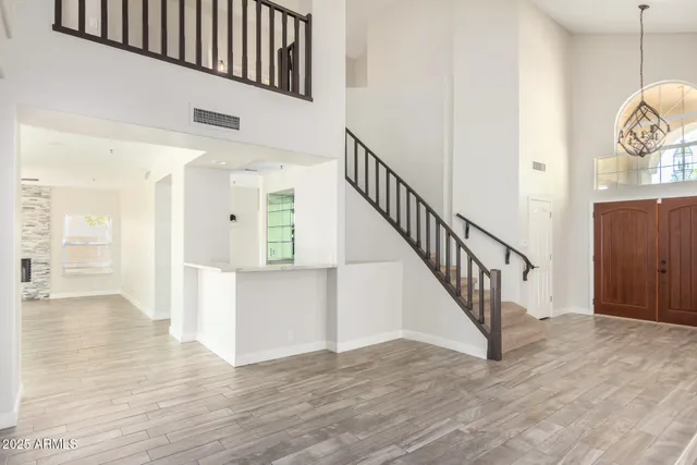 a view of an entryway with wooden floor