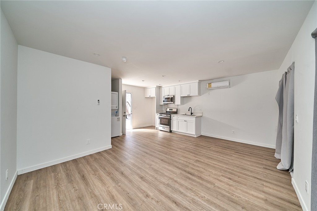 8734 1/2 Ramsgate Avenue Westchester, CA 90045 - Photo 3 of 6 a view of a kitchen with wooden floor